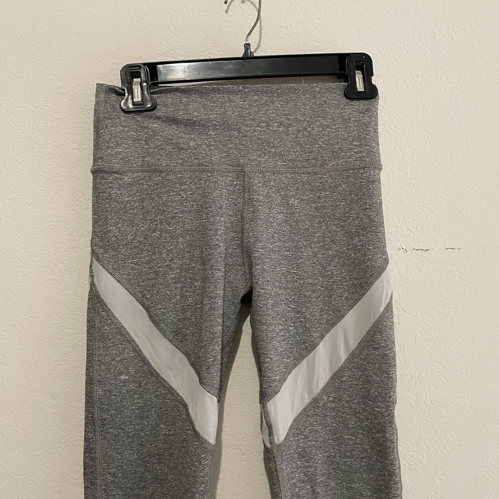 Women's workout leggings in good condition, thick gray fabric with white stripes